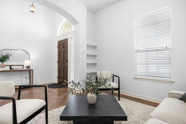 a kitchen with kitchen island granite countertop a sink stove and refrigerator