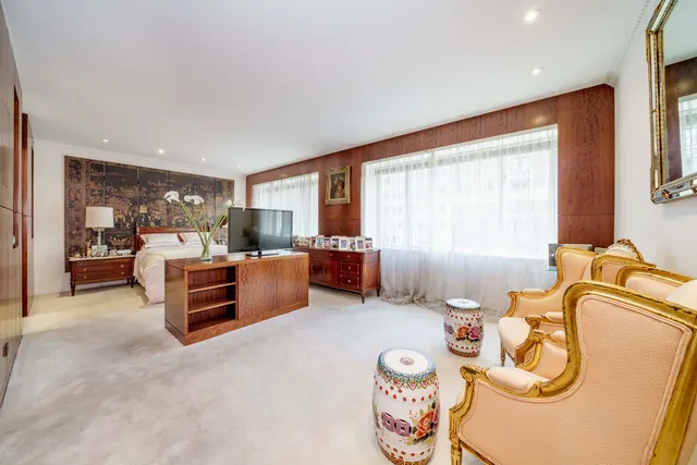 a bed room with furniture and a window