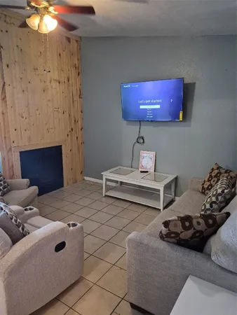 a bedroom with furniture and a fireplace