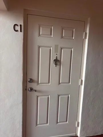 a view of an entryway with a mirror