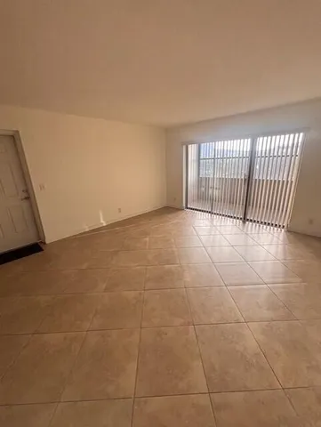 a kitchen with a refrigerator sink and stove