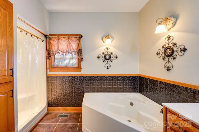 a bathroom with a bathtub and a shower