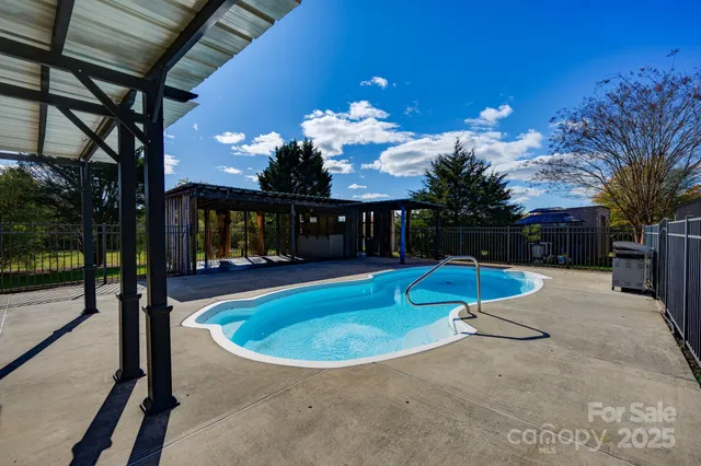 a view of a house with swimming pool