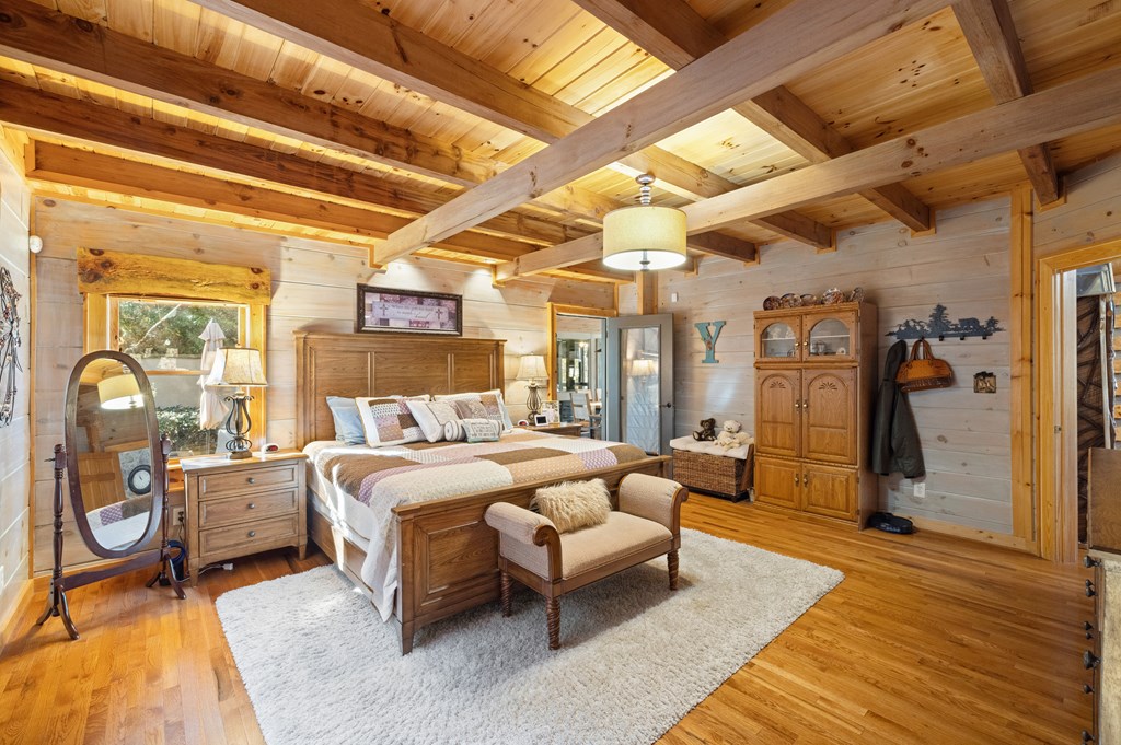 60 Ford Road Dahlonega, GA 30533 - Photo 15 of 59 a bedroom with furniture and a large window