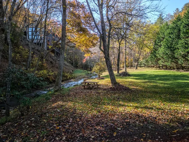 a living room with patio furniture and a flat screen tv