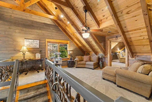 a bedroom with furniture and a flat screen tv