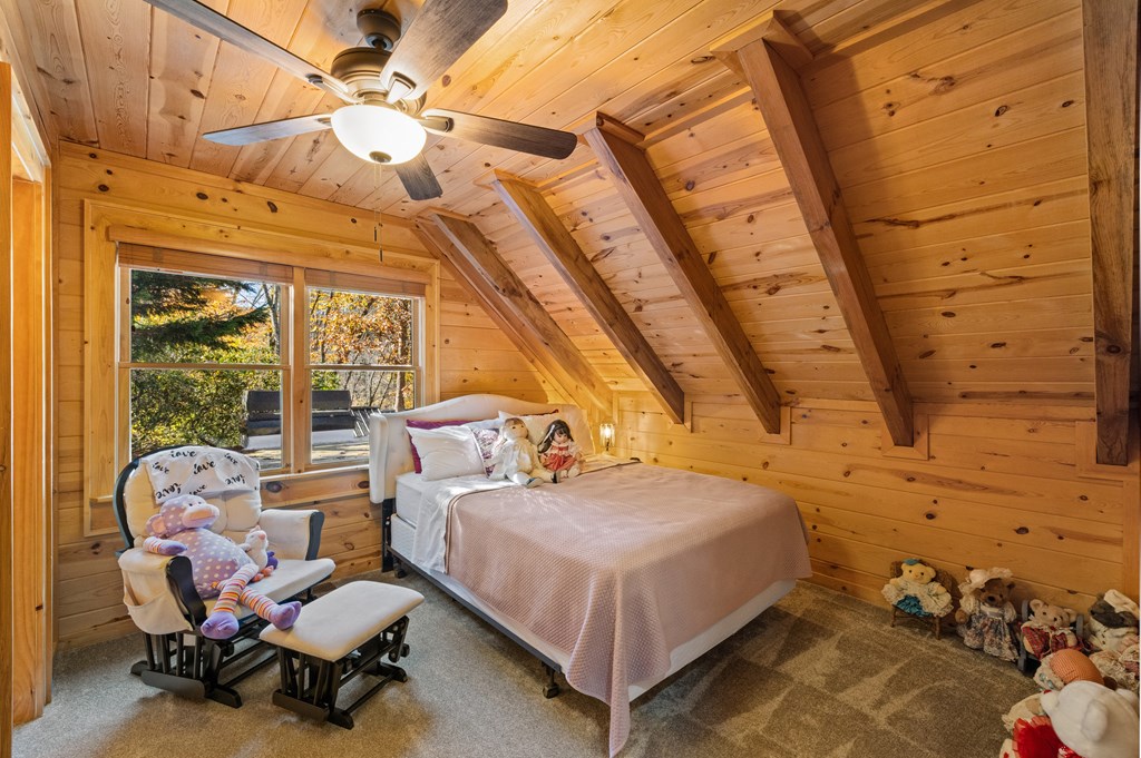 60 Ford Road Dahlonega, GA 30533 - Photo 29 of 59 a bedroom with a bed and wooden floor