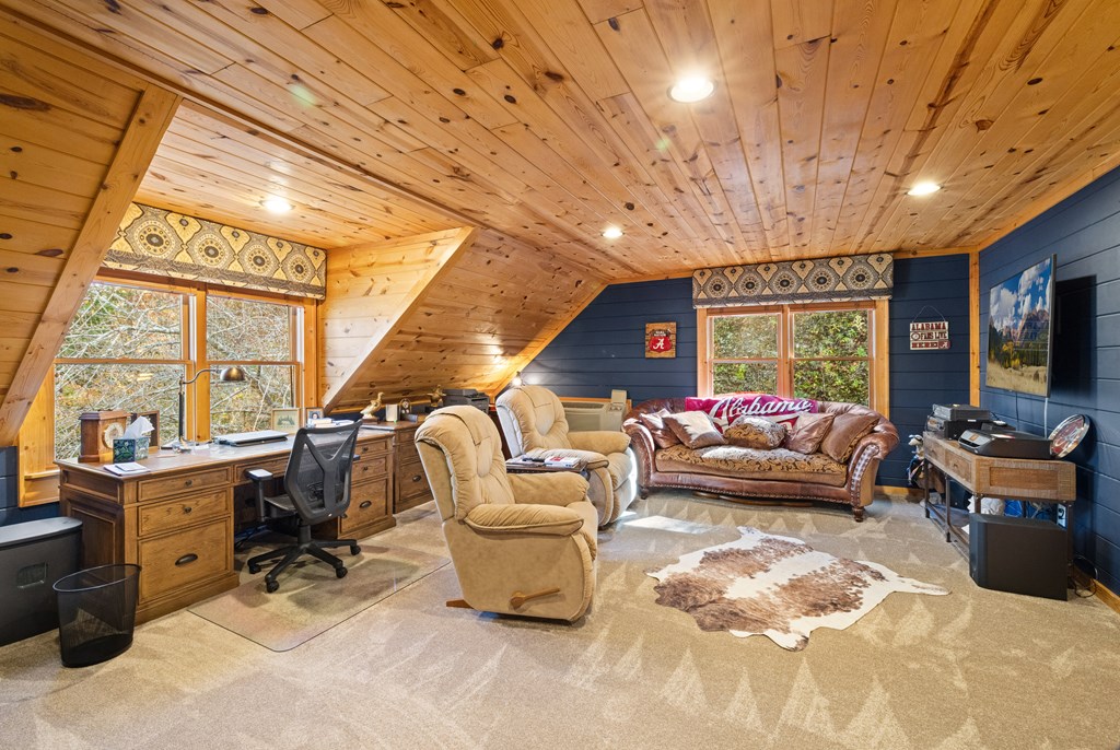 60 Ford Road Dahlonega, GA 30533 - Photo 31 of 59 a living room with patio furniture and a flat screen tv