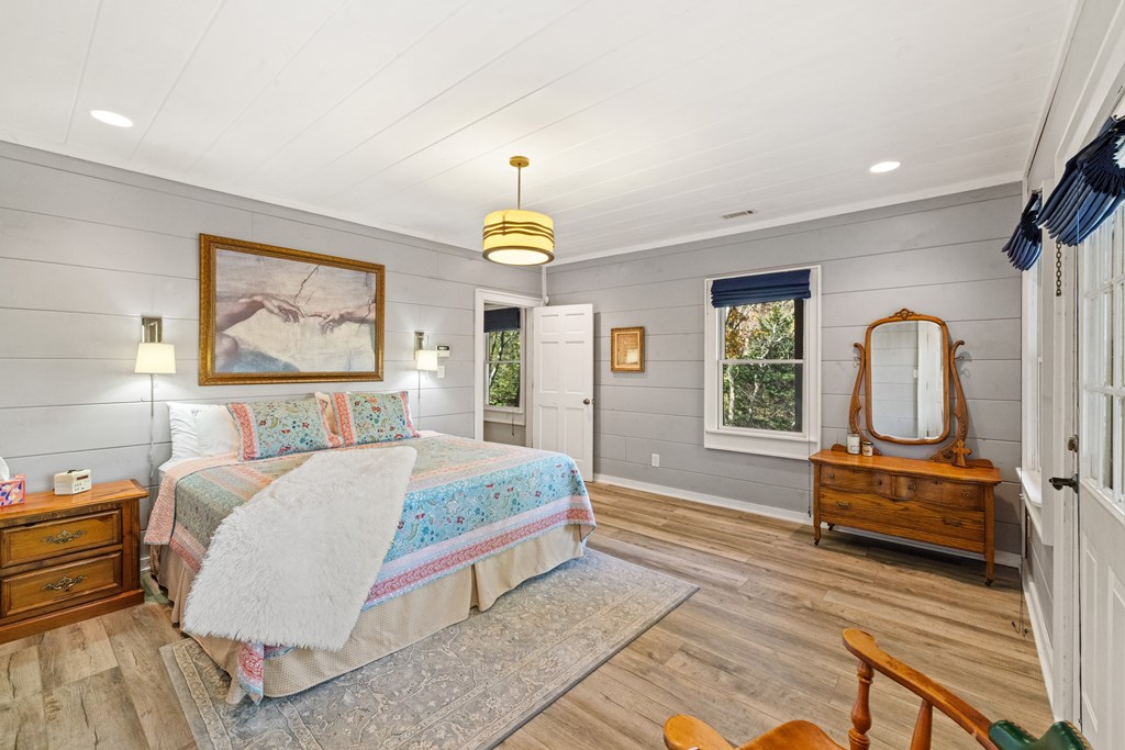 60 Ford Road Dahlonega, GA 30533 - Photo 36 of 59 a bedroom with a bed a dresser and next to a window