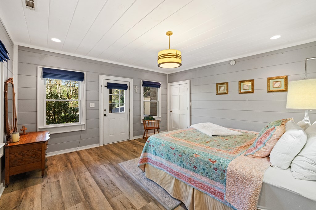 60 Ford Road Dahlonega, GA 30533 - Photo 37 of 59 a bedroom with a bed and a chandelier