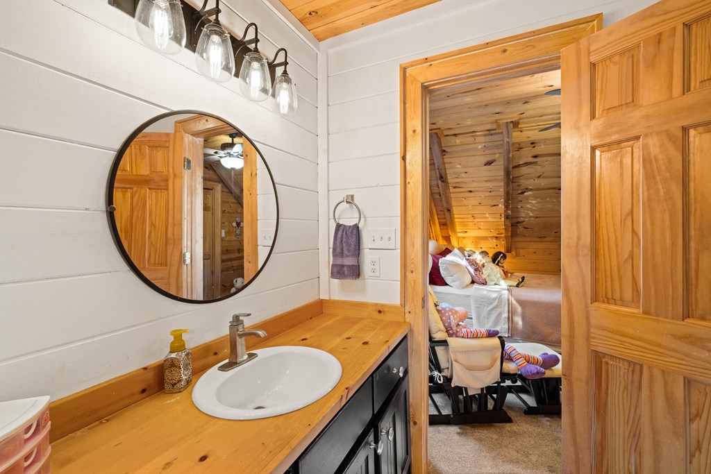 60 Ford Road Dahlonega, GA 30533 - Photo 38 of 59 a bathroom with a sink and a mirror