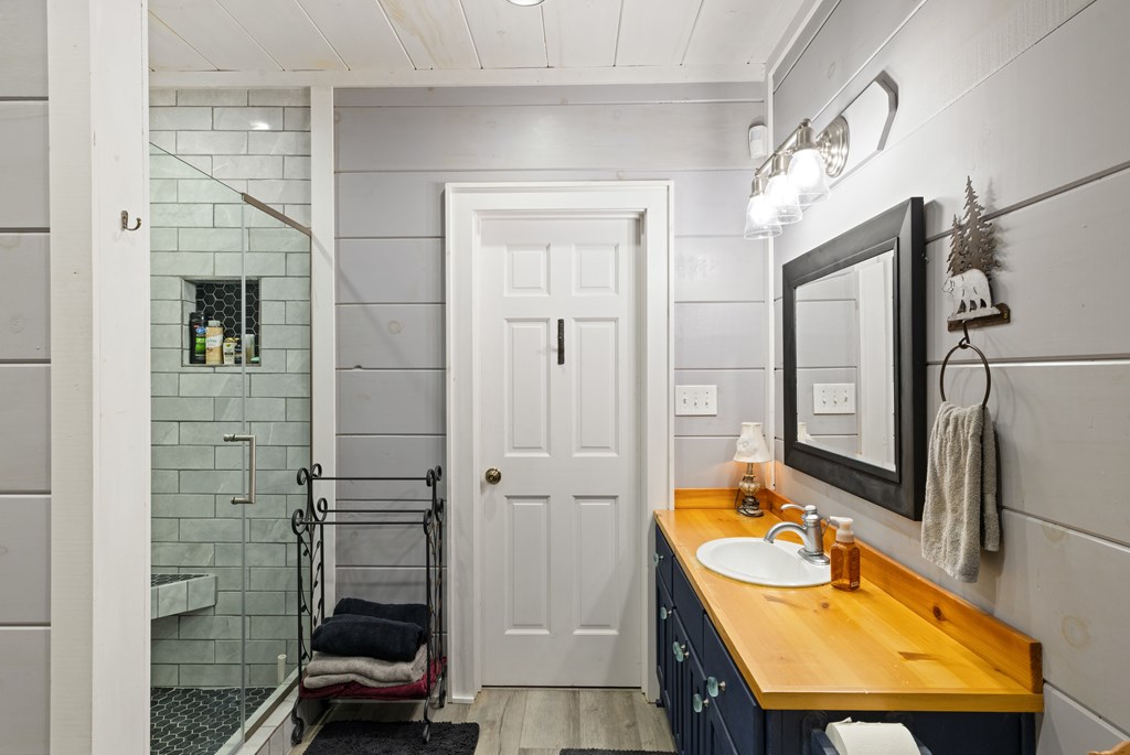 60 Ford Road Dahlonega, GA 30533 - Photo 40 of 59 a bathroom with a sink a toilet and shower