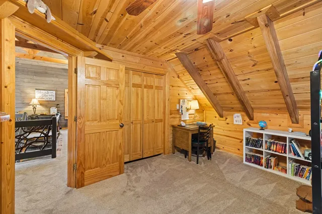 a backyard of a house with barbeque oven table and chairs
