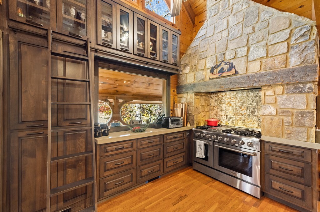 60 Ford Road Dahlonega, GA 30533 - Photo 5 of 59 a kitchen with stainless steel appliances granite countertop a stove and a refrigerator