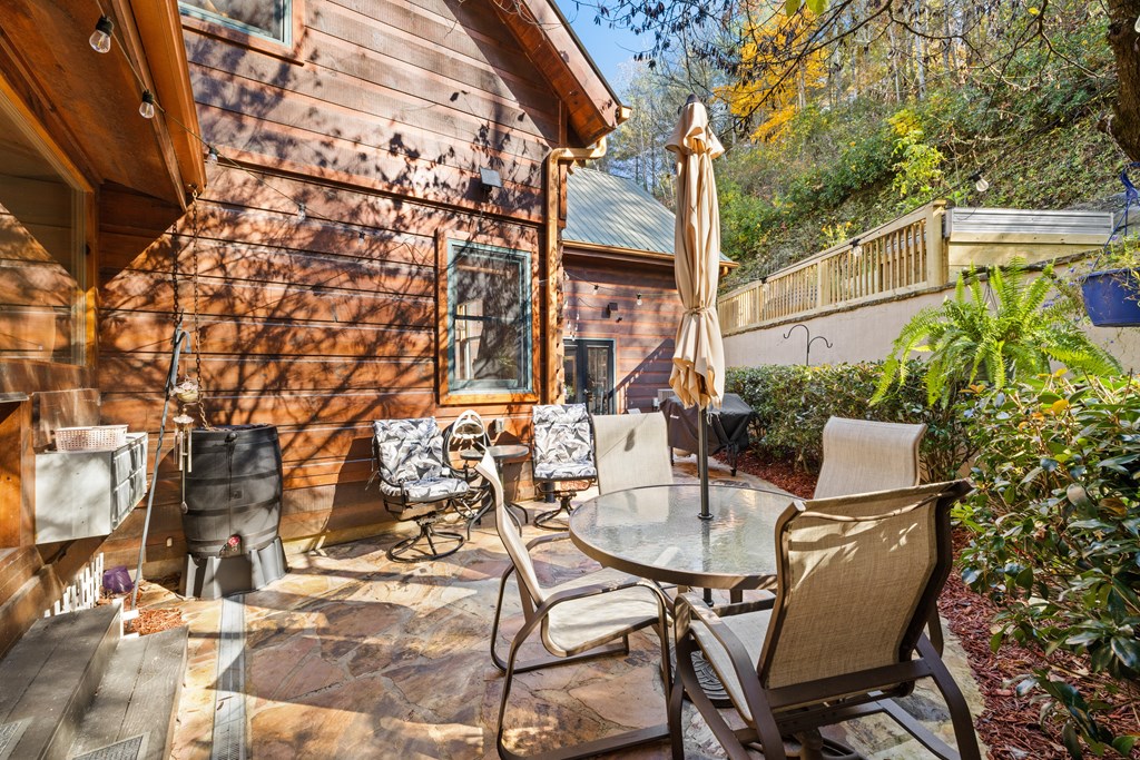60 Ford Road Dahlonega, GA 30533 - Photo 52 of 59 a patio with table and chairs and potted plants