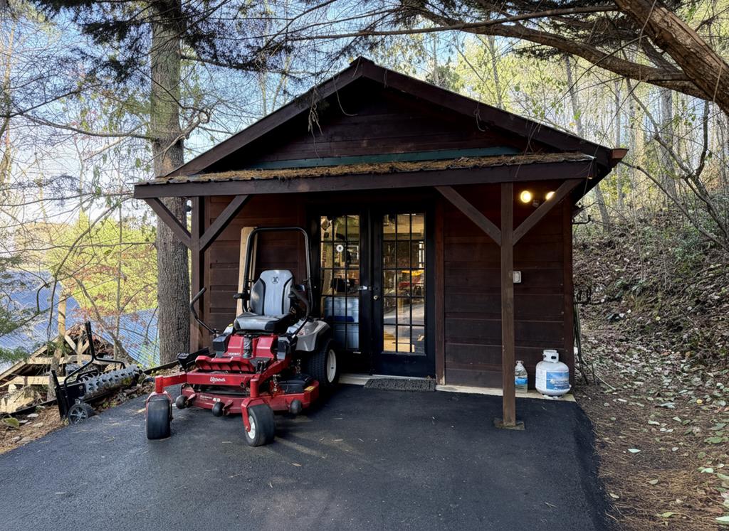 60 Ford Road Dahlonega, GA 30533 - Photo 58 of 59 a backyard of a house with barbeque oven table and chairs