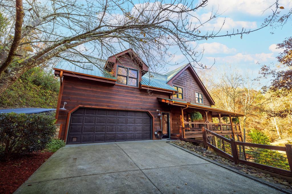 60 Ford Road Dahlonega, GA 30533 - Photo 7 of 59 a front view of a house with a yard and garage