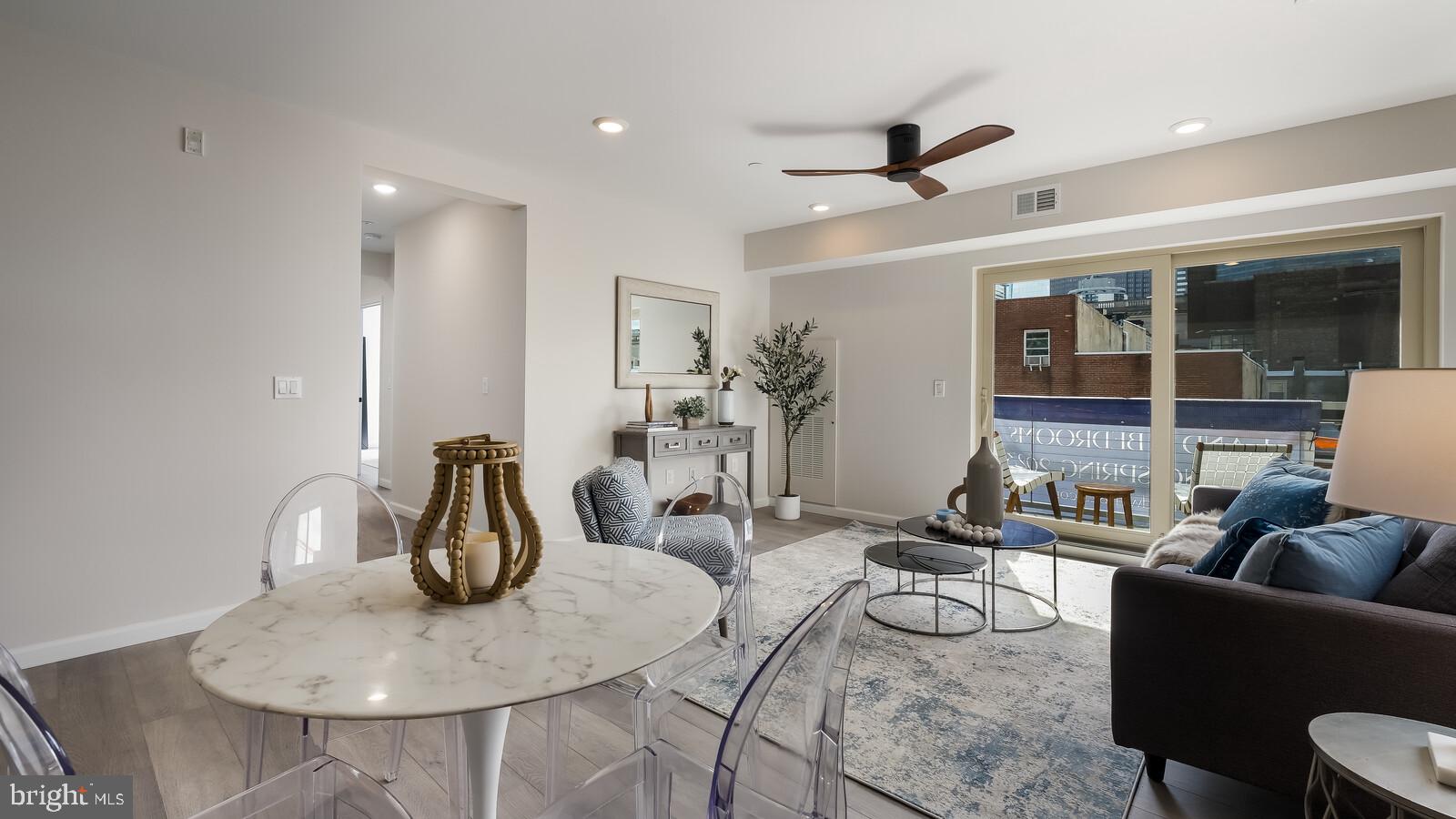 1825 Callowhill Street, Unit 504 Philadelphia, PA 19130 - Photo 12 of 49 a living room with furniture and a large window