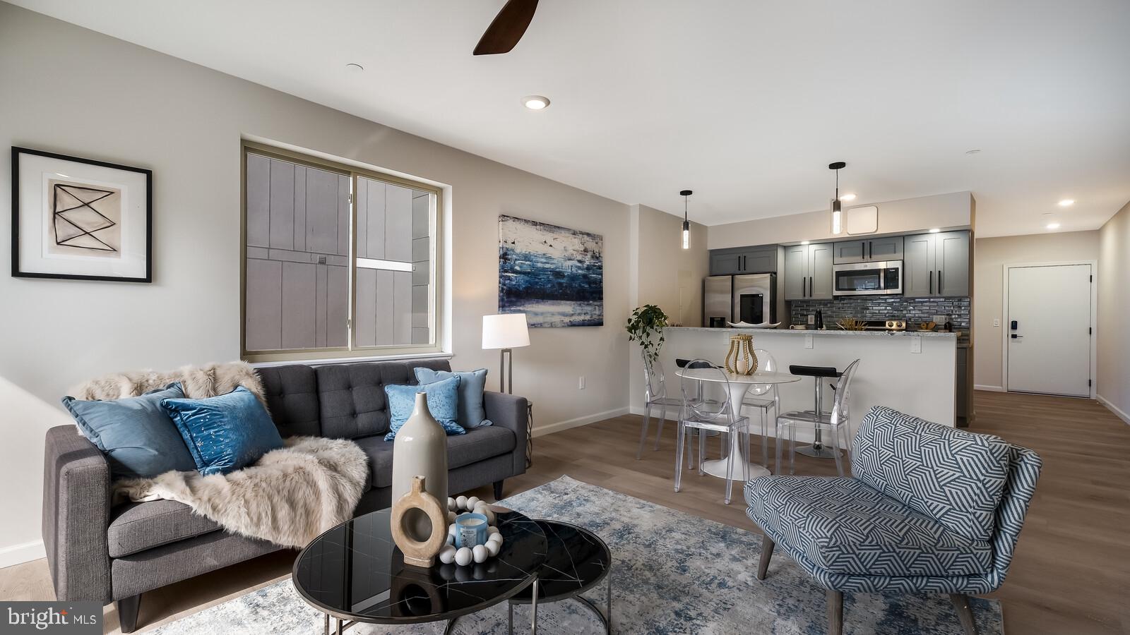 1825 Callowhill Street, Unit 504 Philadelphia, PA 19130 - Photo 15 of 49 a living room with furniture and kitchen view