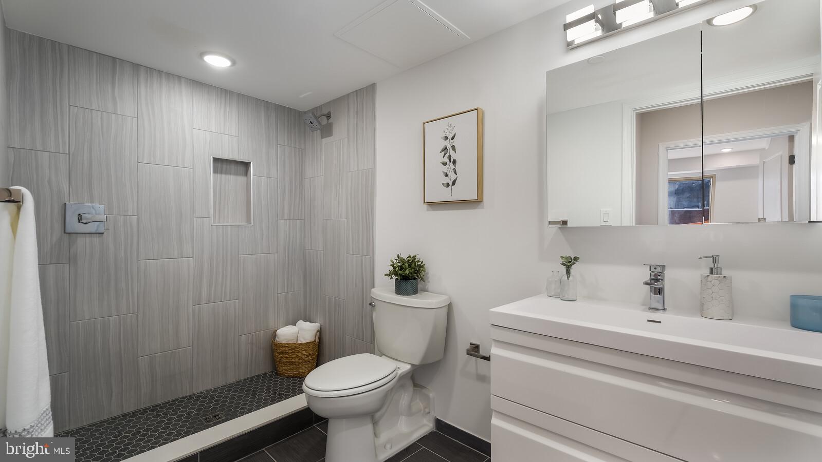 1825 Callowhill Street, Unit 504 Philadelphia, PA 19130 - Photo 16 of 49 a bathroom with a sink toilet and shower