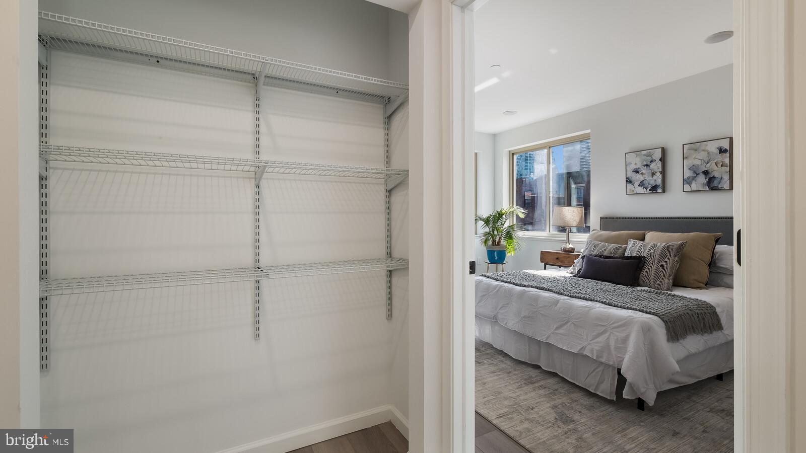 1825 Callowhill Street, Unit 504 Philadelphia, PA 19130 - Photo 19 of 49 a bedroom with a bed and a walk in closet