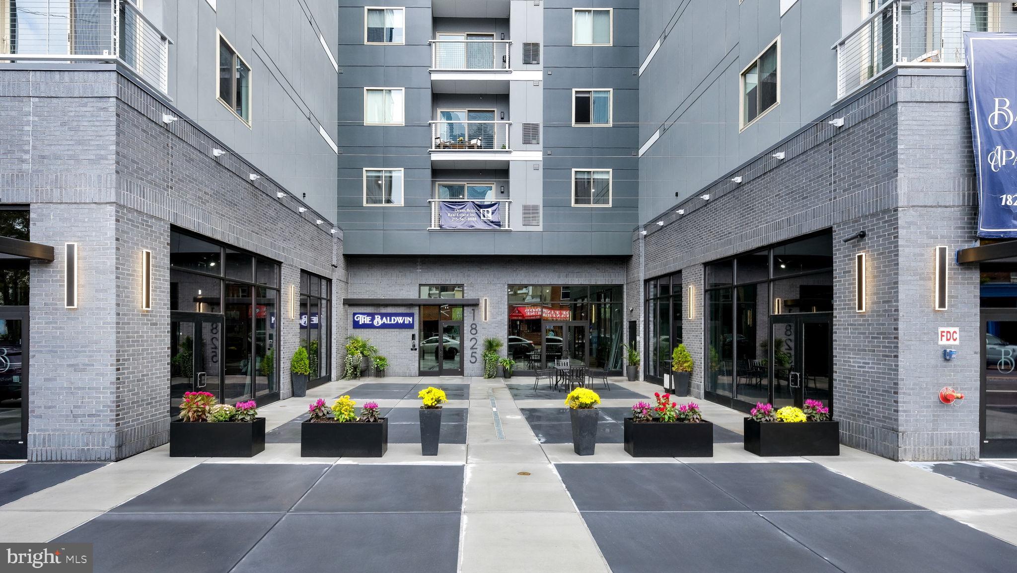 1825 Callowhill Street, Unit 504 Philadelphia, PA 19130 - Photo 41 of 49 a view of building with retail shops