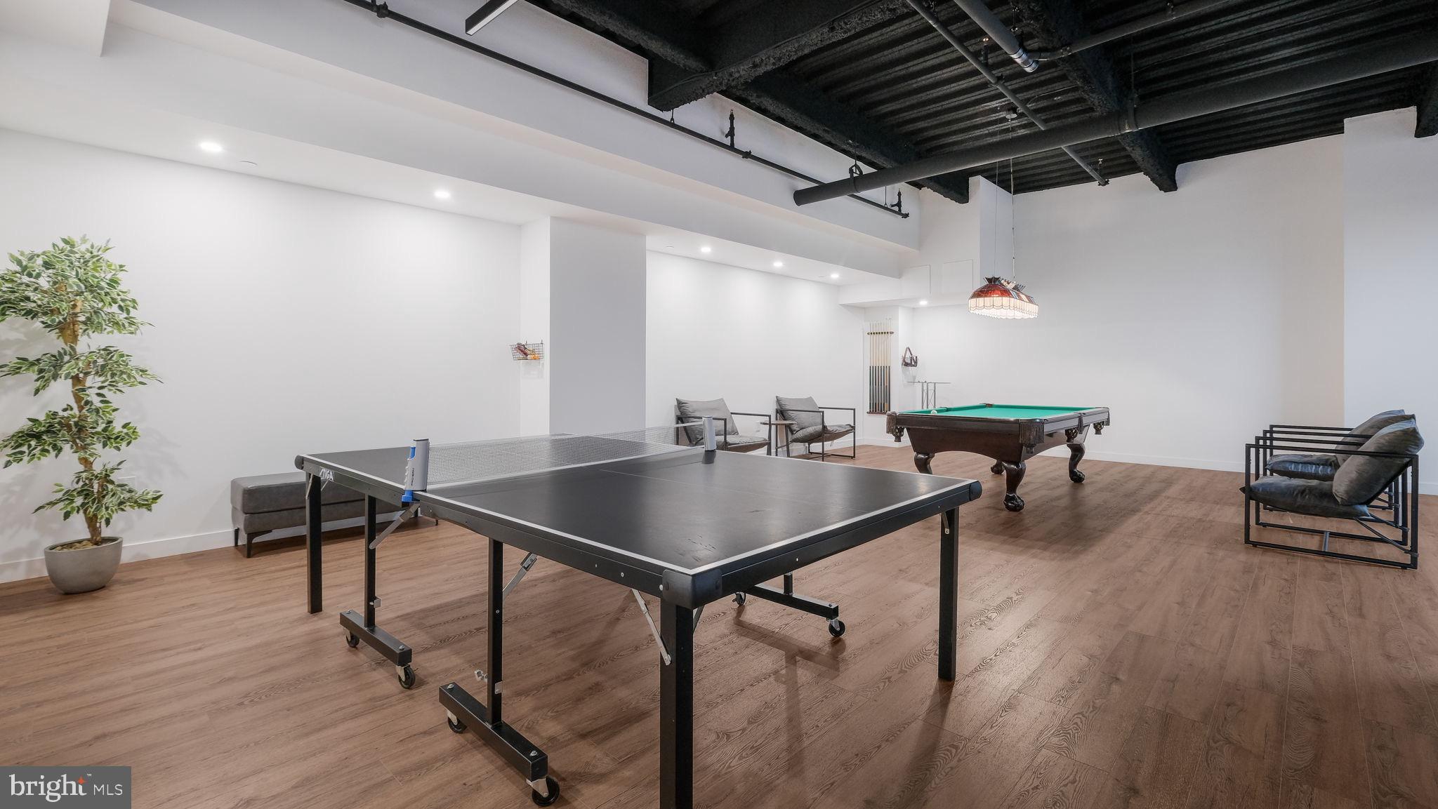 1825 Callowhill Street, Unit 504 Philadelphia, PA 19130 - Photo 46 of 49 a living room with furniture and wooden floor