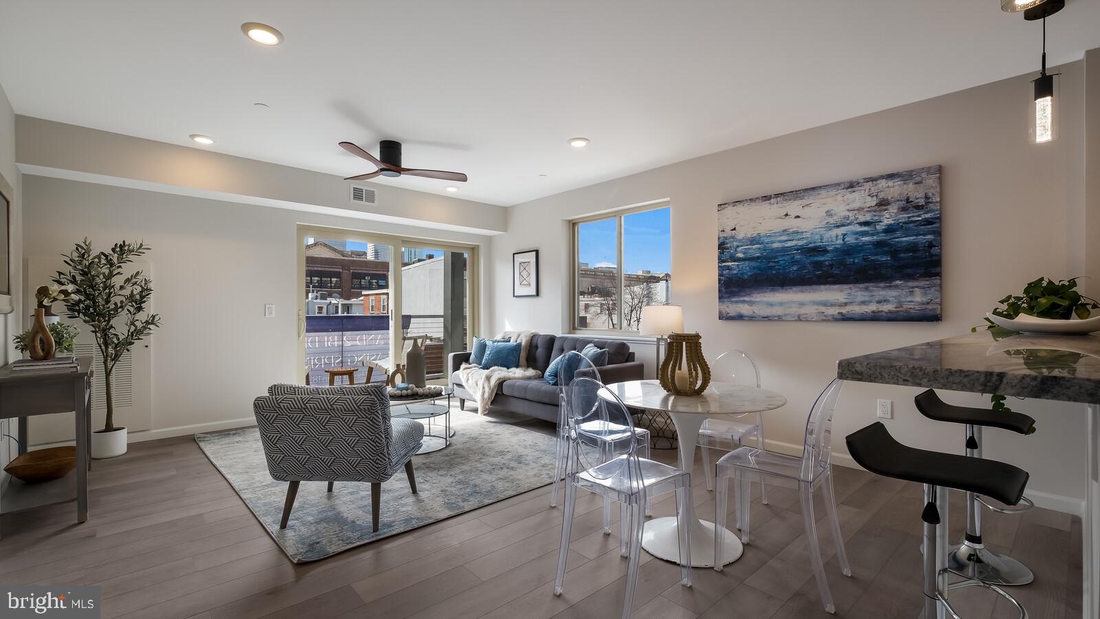 1825 Callowhill Street, Unit 504 Philadelphia, PA 19130 - Photo 8 of 49 a living room with furniture and a potted plant