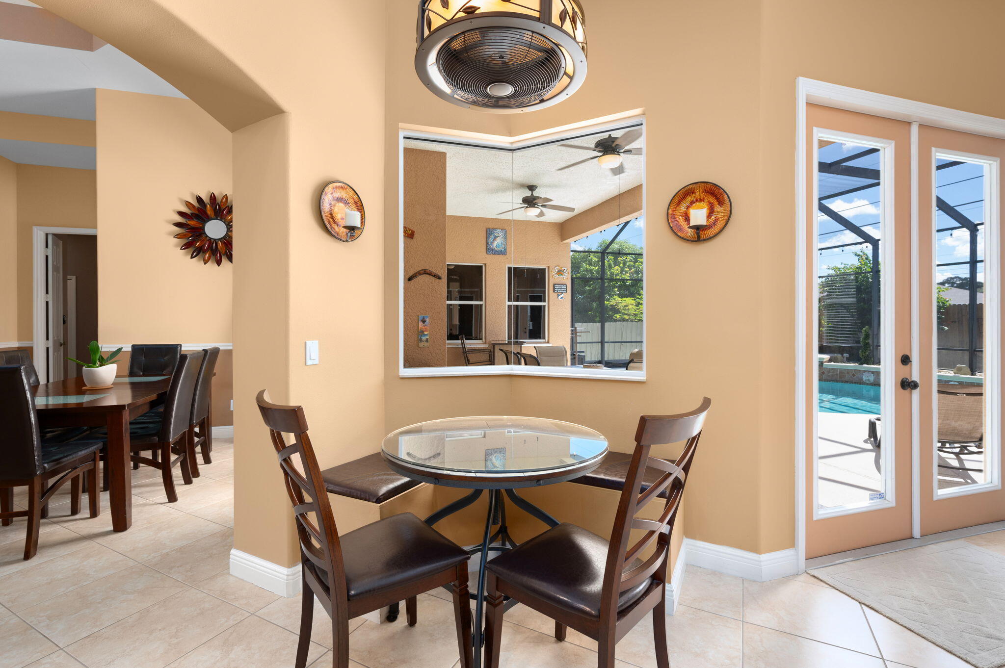 1438 Southwest Apache Avenue Port St. Lucie, FL 34953 - Photo 11 of 34 a dining room with furniture and a window