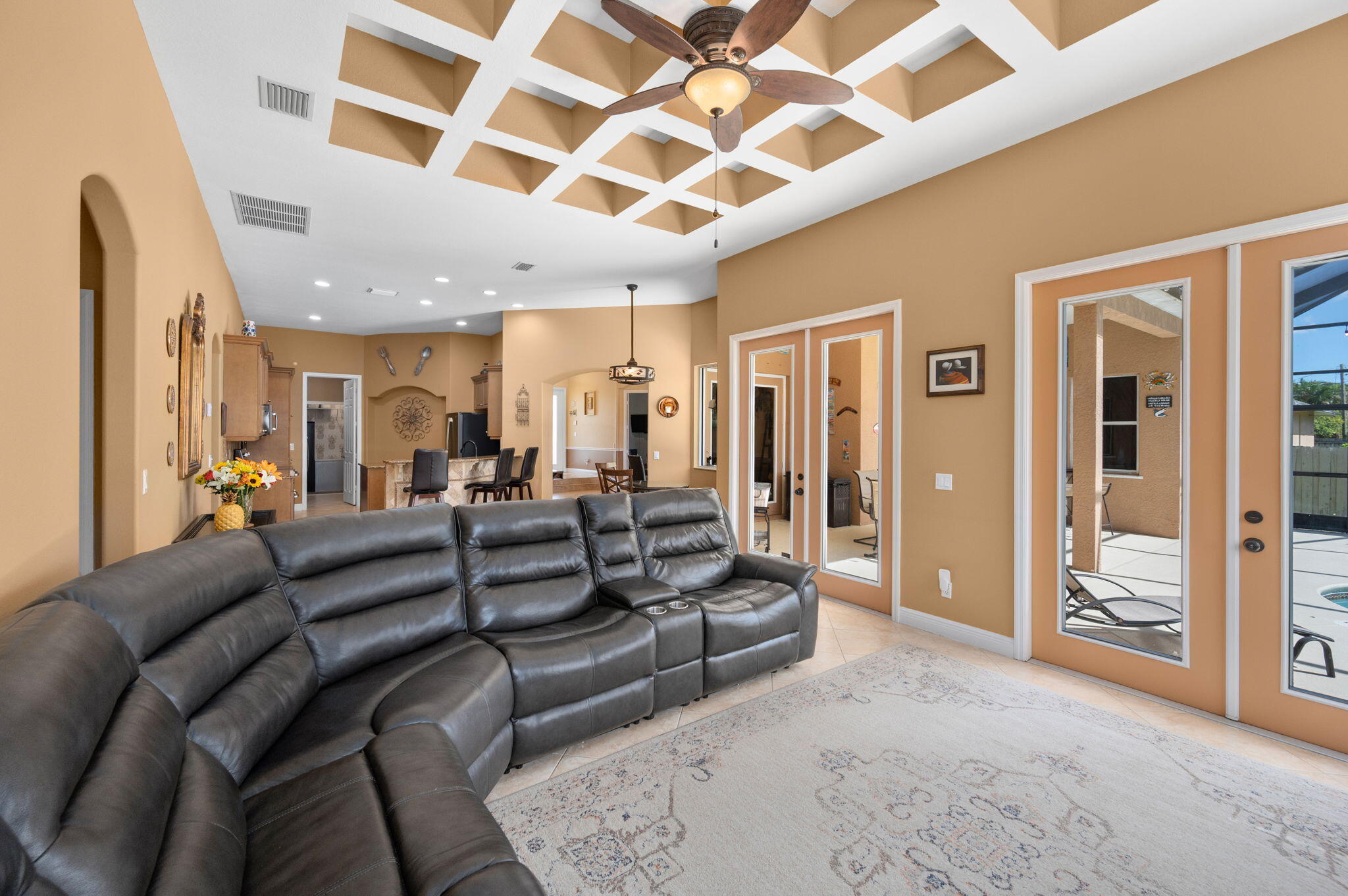 1438 Southwest Apache Avenue Port St. Lucie, FL 34953 - Photo 12 of 34 a living room with furniture and a glass door