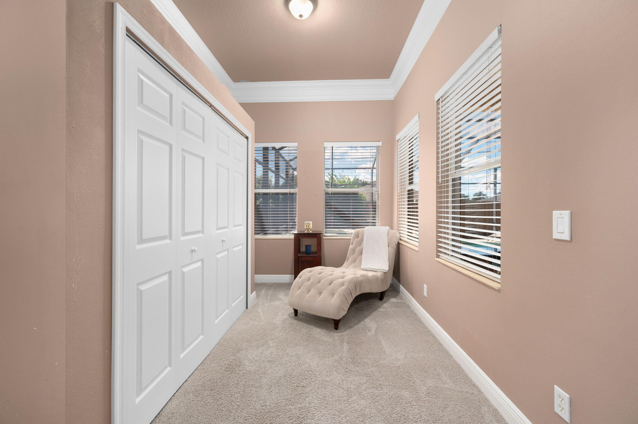 1438 Southwest Apache Avenue Port St. Lucie, FL 34953 - Photo 18 of 34 a bed room with a bed and a window