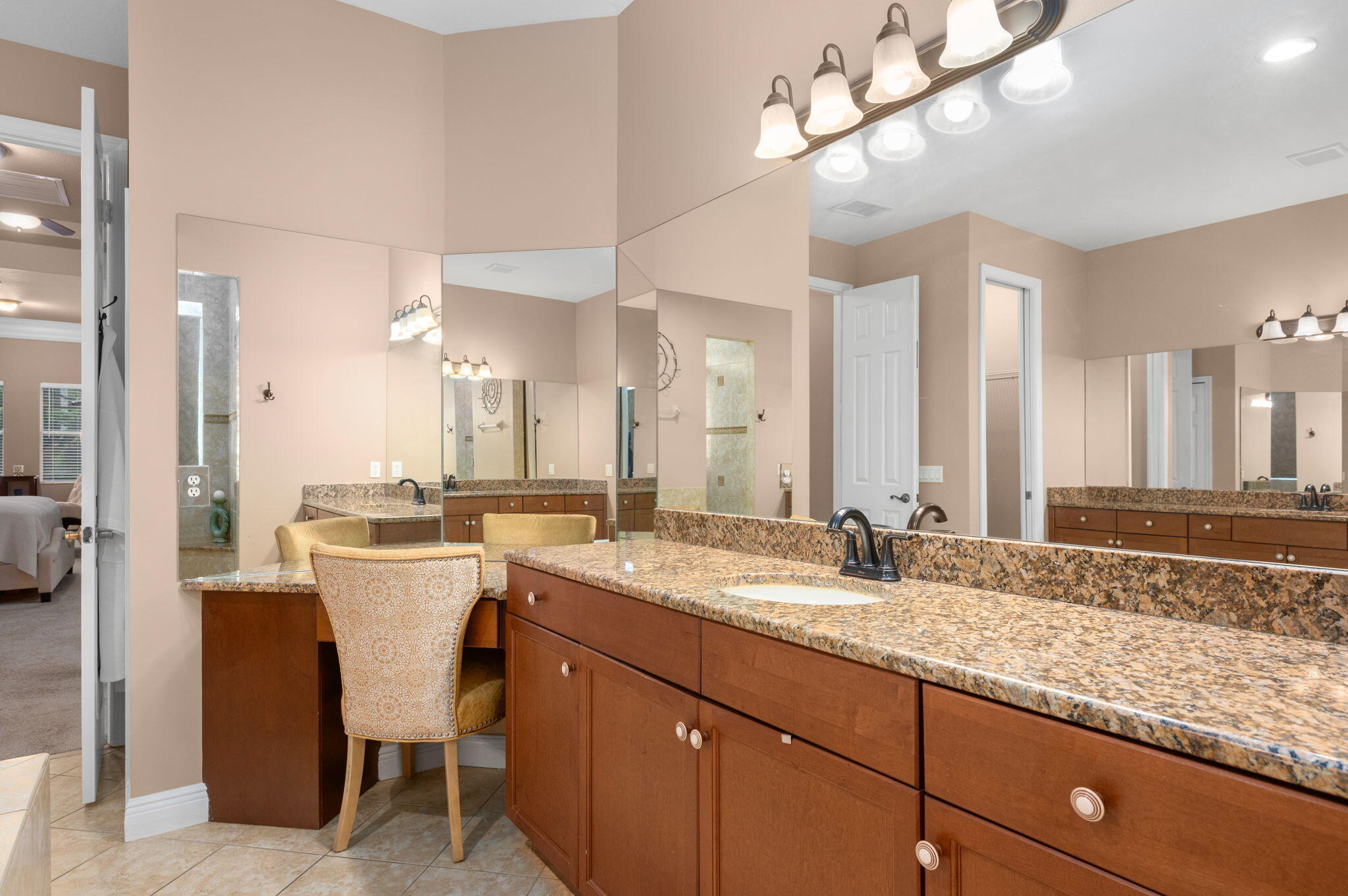 1438 Southwest Apache Avenue Port St. Lucie, FL 34953 - Photo 22 of 34 a bathroom with a sink and a mirror