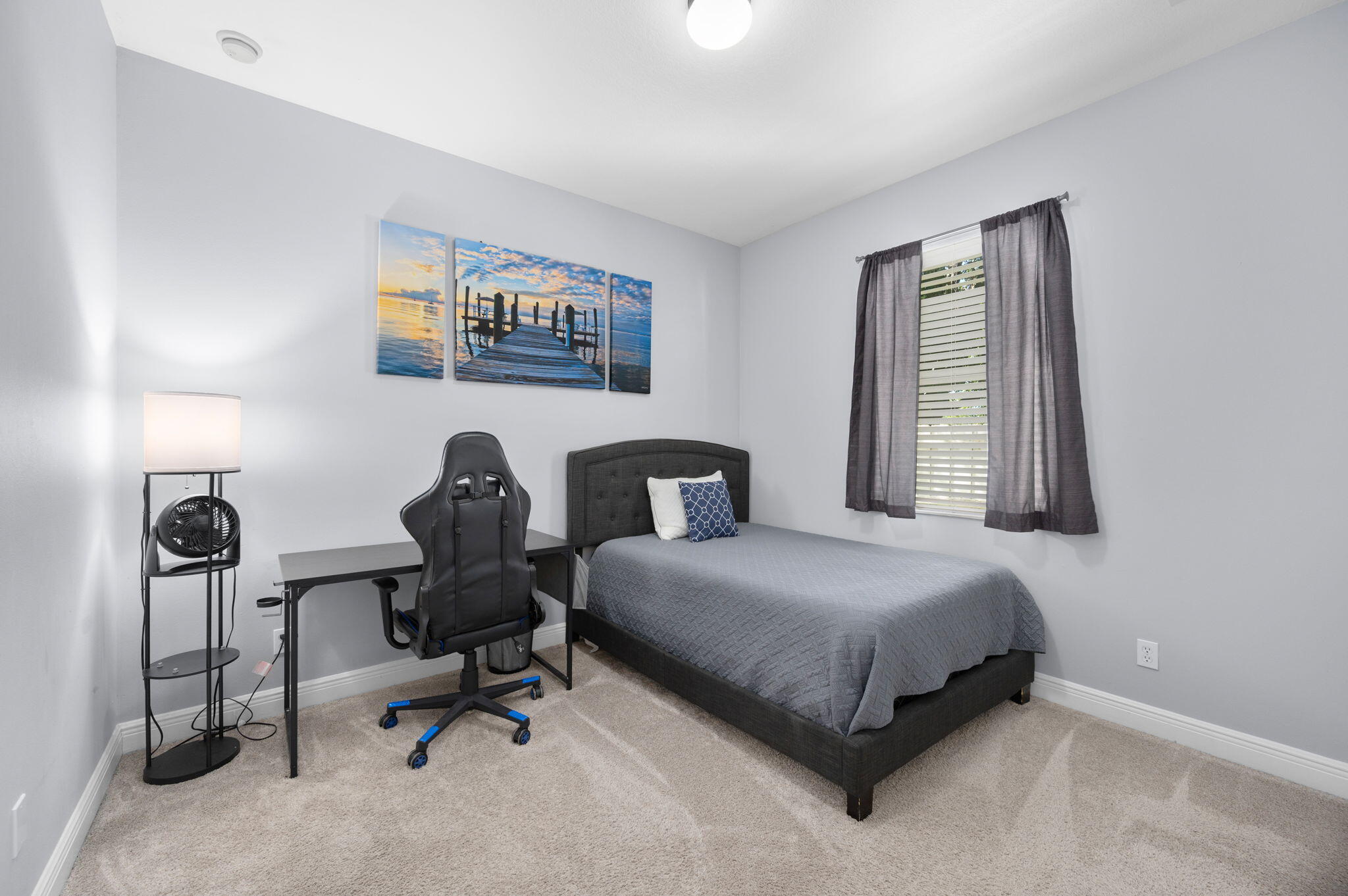 1438 Southwest Apache Avenue Port St. Lucie, FL 34953 - Photo 24 of 34 a bedroom with a bed and a window