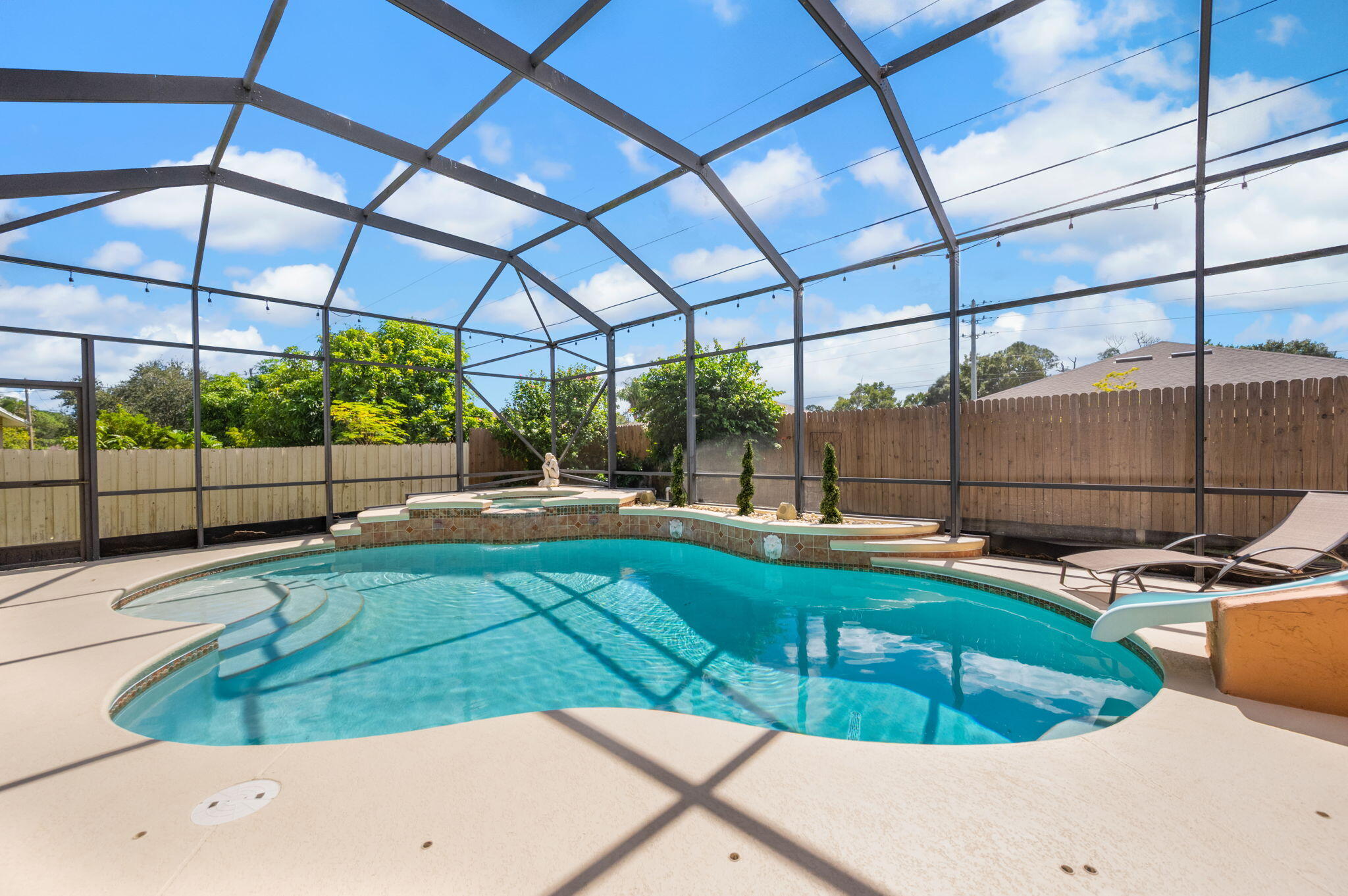1438 Southwest Apache Avenue Port St. Lucie, FL 34953 - Photo 31 of 34 a view of a swimming pool with a patio