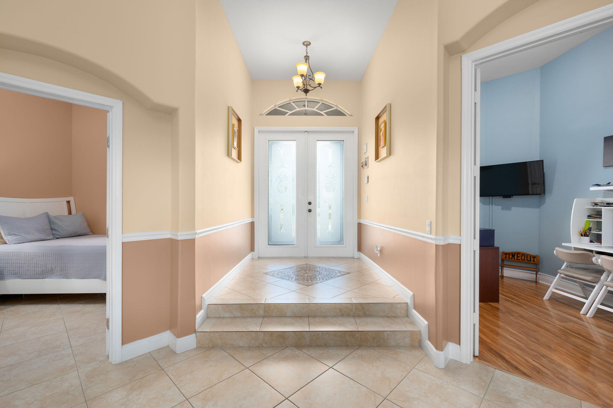 1438 Southwest Apache Avenue Port St. Lucie, FL 34953 - Photo 4 of 34 a living room with furniture and a flat screen tv