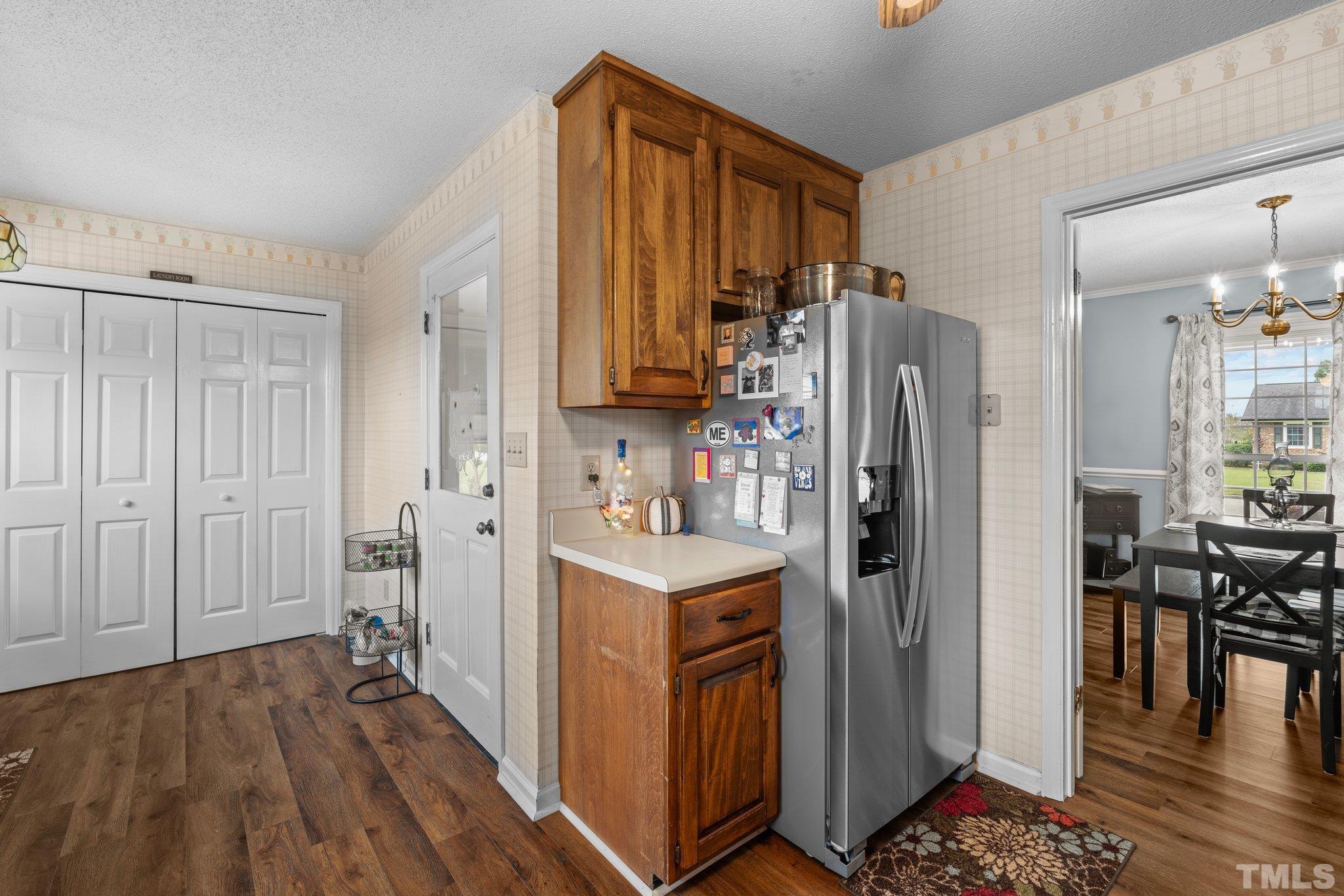 107 Murchison Drive Dunn, NC 28334 - Photo 15 of 37 a kitchen with stainless steel appliances granite countertop a refrigerator and a stove top oven