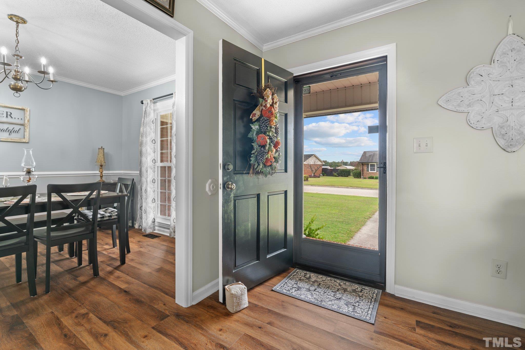 107 Murchison Drive Dunn, NC 28334 - Photo 18 of 37 a view of a hallway and dining room with furniture