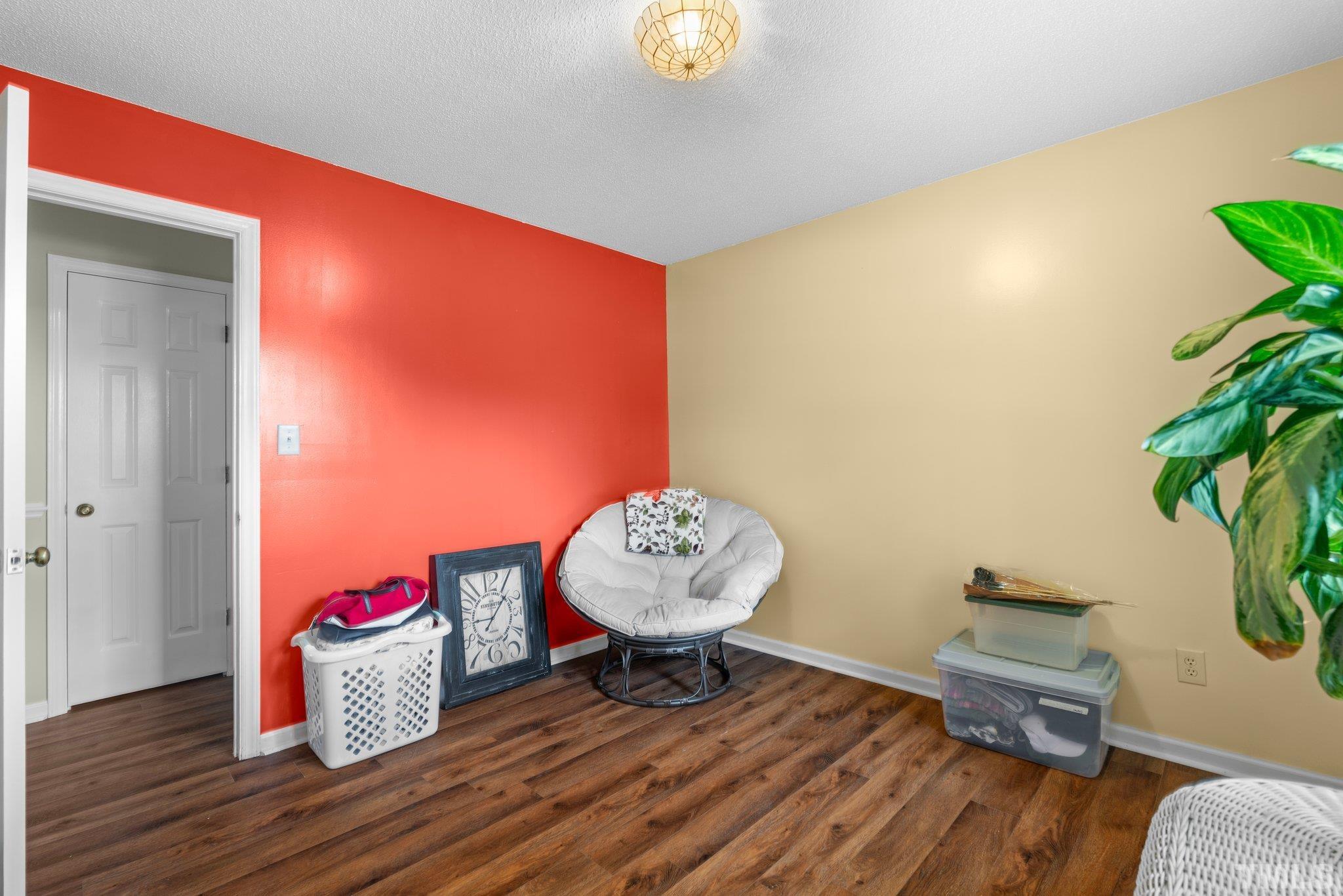 107 Murchison Drive Dunn, NC 28334 - Photo 19 of 37 a living room with furniture and a potted plant