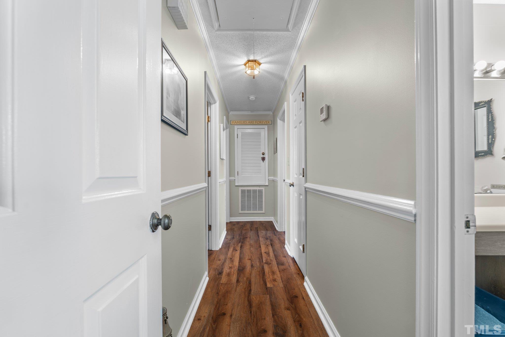 107 Murchison Drive Dunn, NC 28334 - Photo 21 of 37 a view of a hallway with wooden floor and staircase
