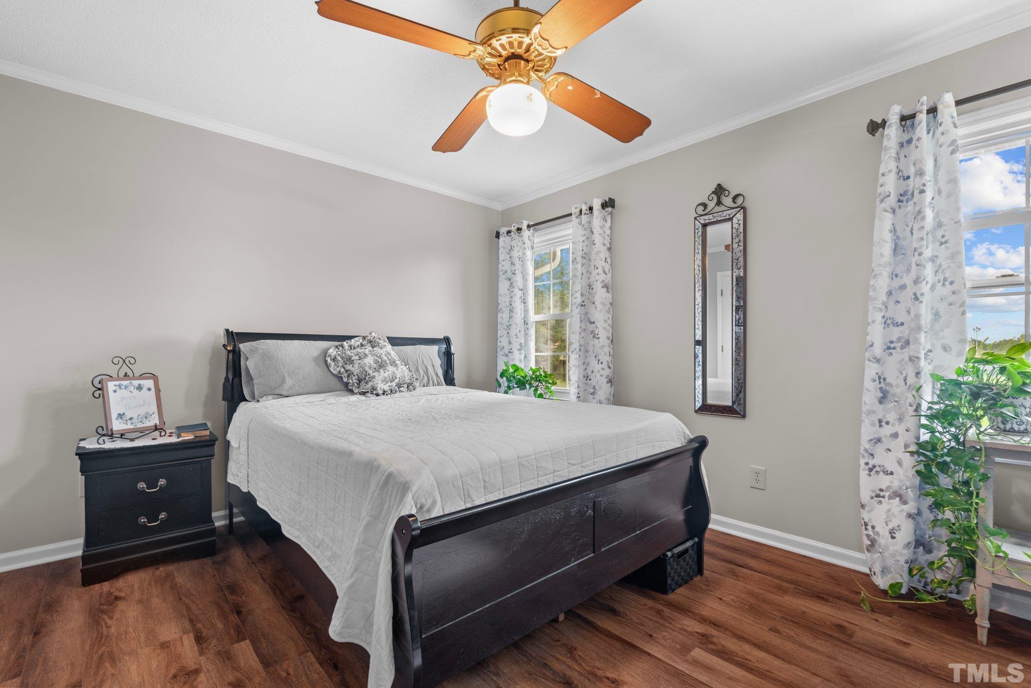 107 Murchison Drive Dunn, NC 28334 - Photo 24 of 37 a bedroom with a bed and a closet