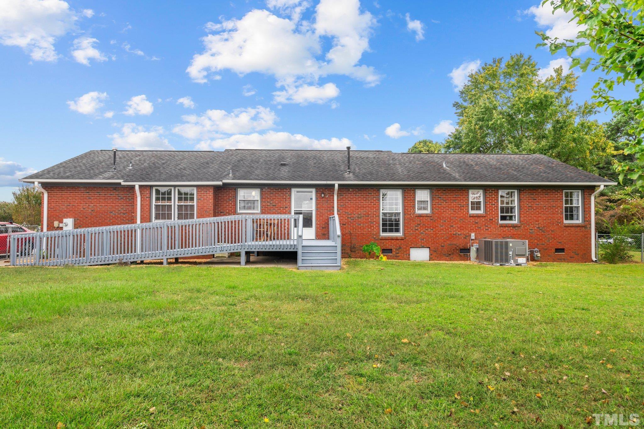 107 Murchison Drive Dunn, NC 28334 - Photo 30 of 37 a view of a house with backyard
