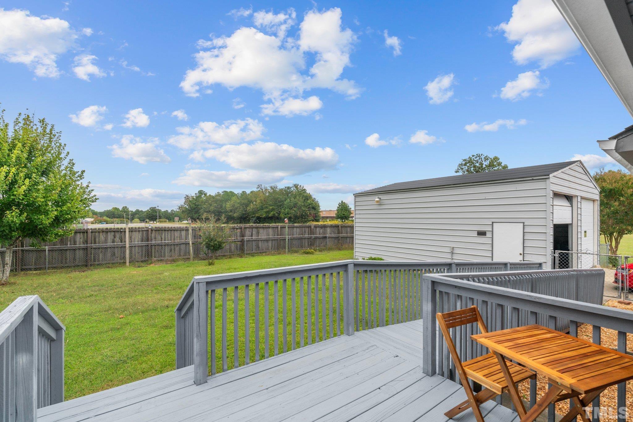 107 Murchison Drive Dunn, NC 28334 - Photo 36 of 37 a view of a chairs and table on the deck