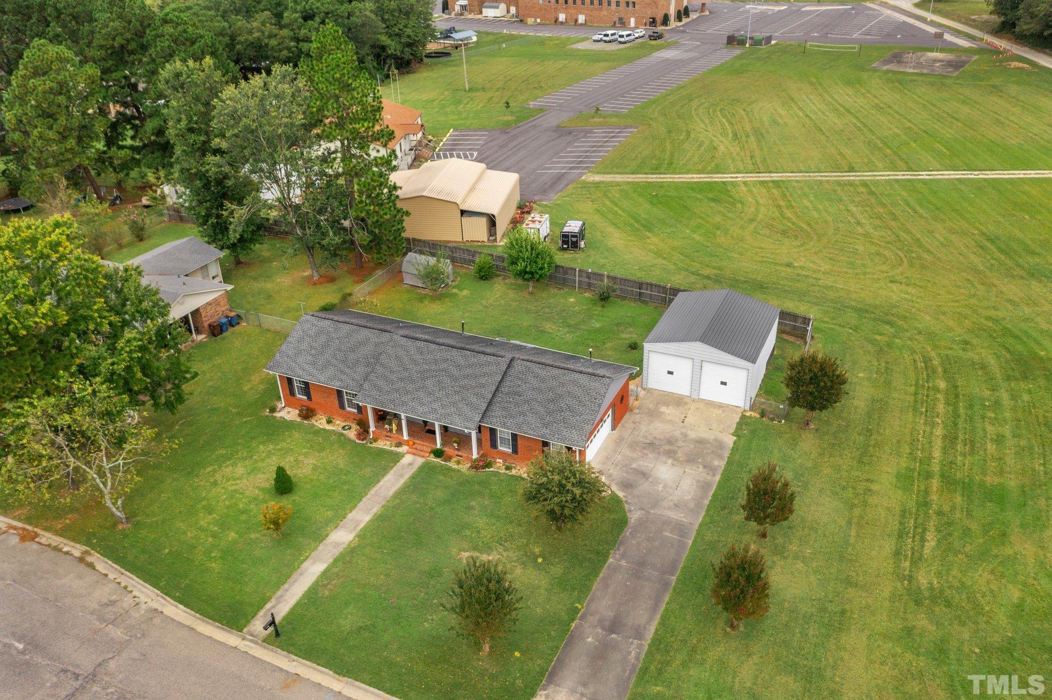 107 Murchison Drive Dunn, NC 28334 - Photo 37 of 37 an aerial view of a house with pool