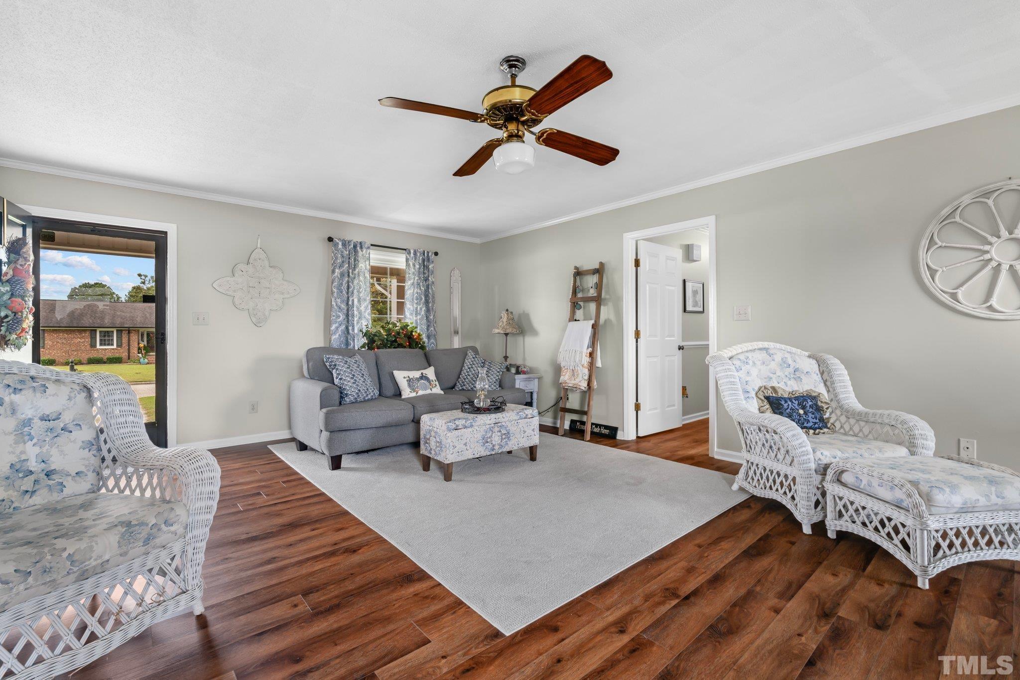 107 Murchison Drive Dunn, NC 28334 - Photo 7 of 37 a living room with furniture and a wooden floor