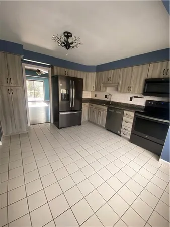 a room with pool table and flat screen tv
