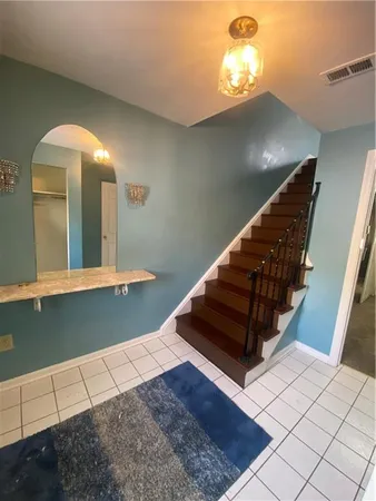 a view of entryway and hall with a window