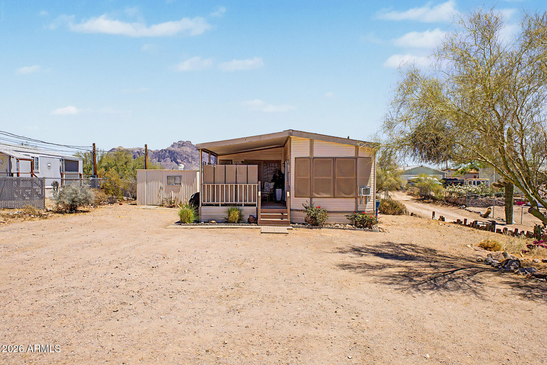 479 North Cactus Road Apache Junction, AZ 85119 - Photo 1 of 29 a view of a house with a yard covered in snow