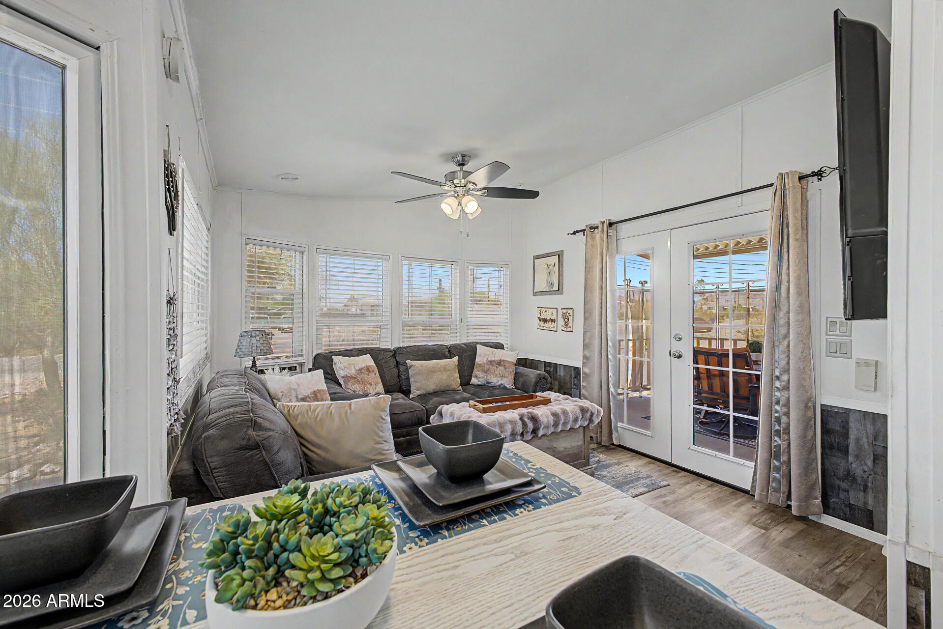 479 North Cactus Road Apache Junction, AZ 85119 - Photo 11 of 29 a living room with furniture and a ceiling fan