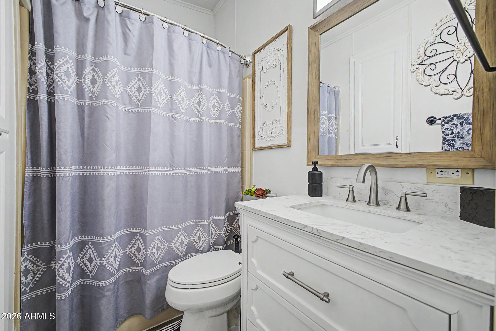 479 North Cactus Road Apache Junction, AZ 85119 - Photo 23 of 29 a bathroom with a granite countertop sink mirror vanity and toilet