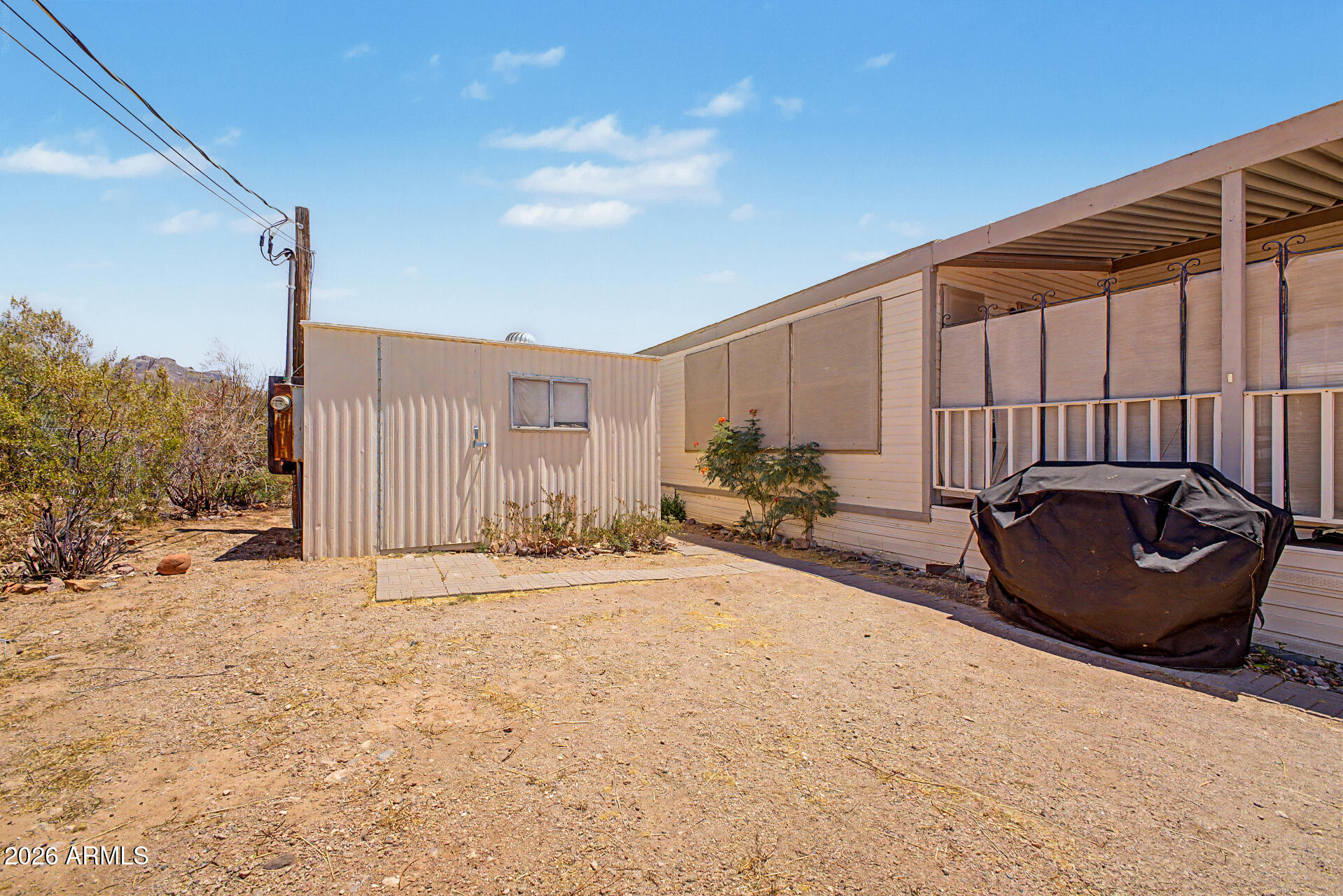 479 North Cactus Road Apache Junction, AZ 85119 - Photo 4 of 29 a view of a back yard of the house